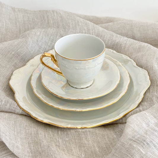 Antique pearlescent four-piece tea set, sold as set