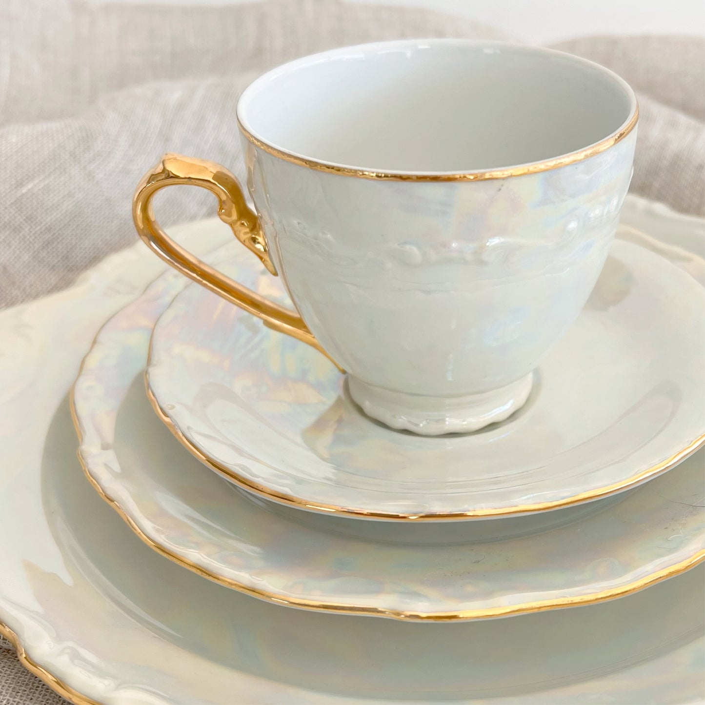 Antique pearlescent four-piece tea set, sold as set