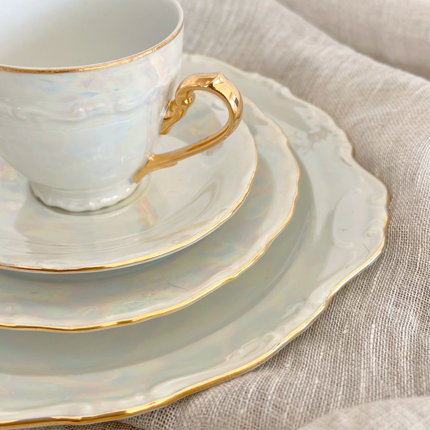 Antique pearlescent four-piece tea set, sold as set