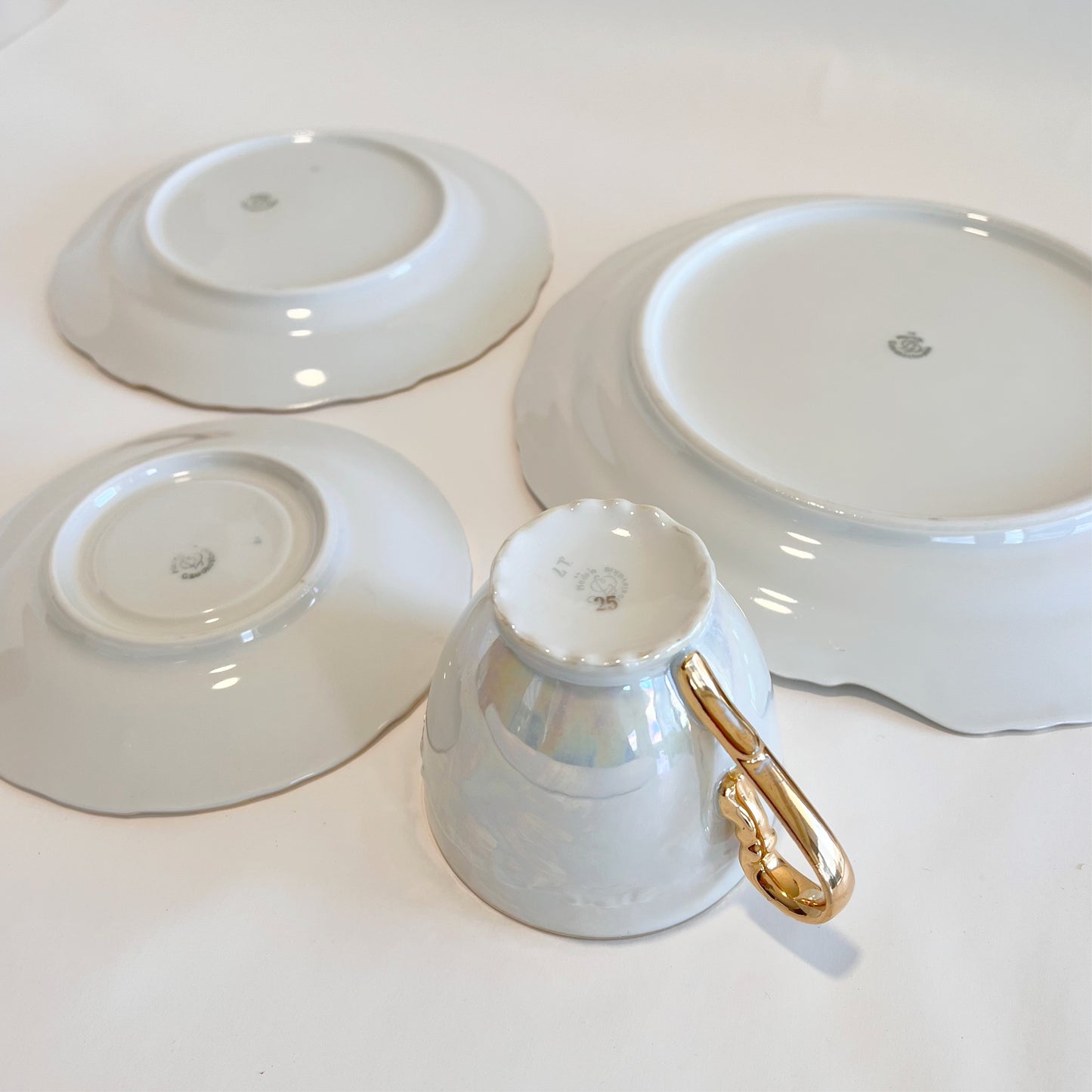 Antique pearlescent four-piece tea set, sold as set