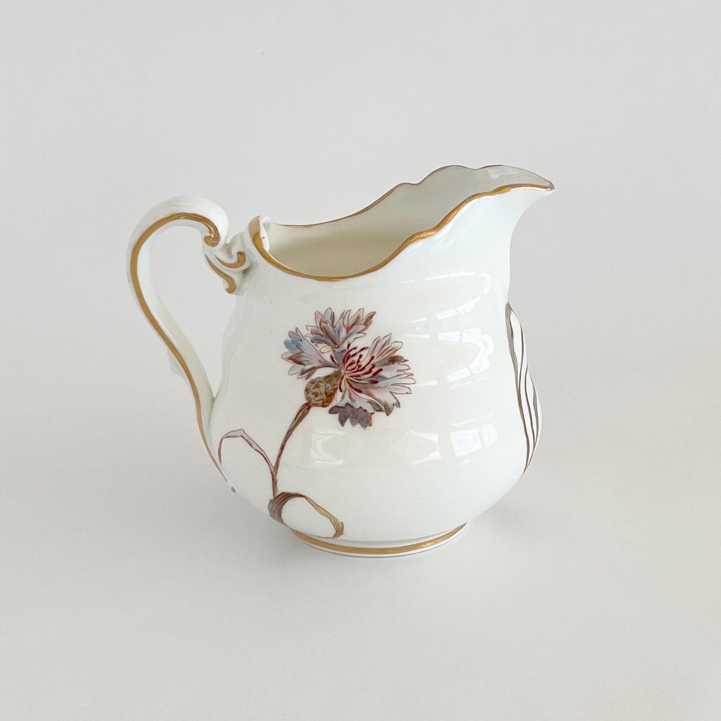 English vintage milk jug with corn flower pattern and gilt detail
