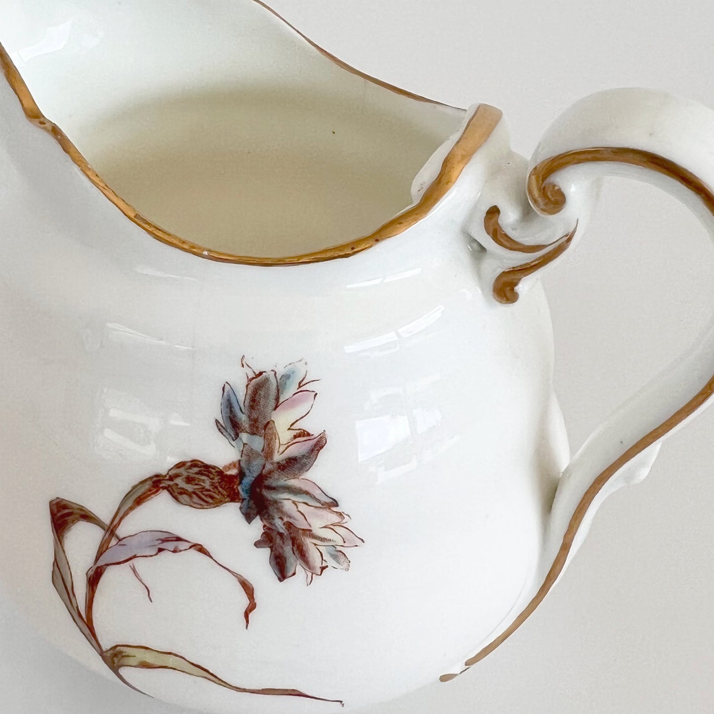 English vintage milk jug with corn flower pattern and gilt detail