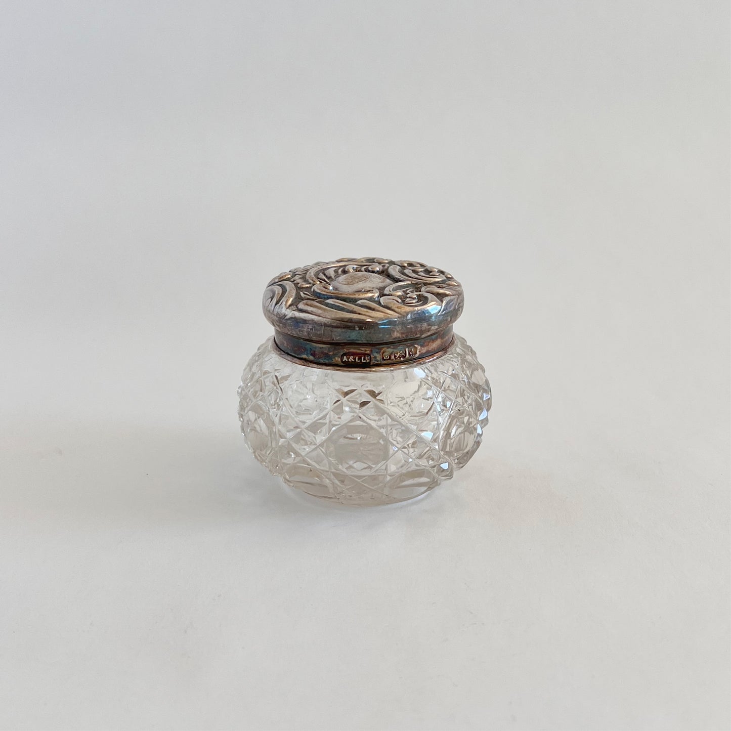 Antique glass dressing table jar with silver-plated lid